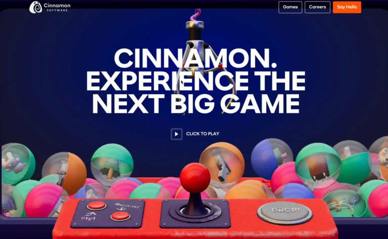 Cinnamon Software homepage with large introductory type, a click-to-play button and the colourful 3D claw machine.